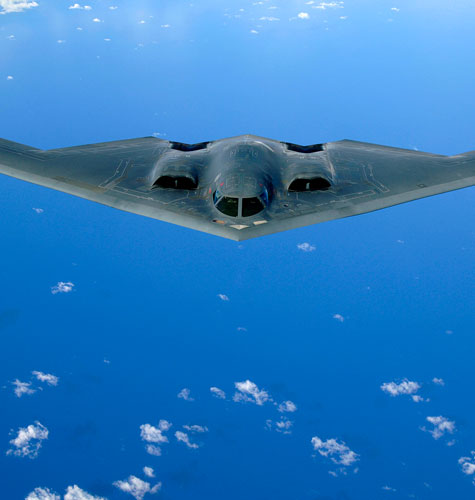 A B-2 Spirit soars after a refueling mission over the Pacific Ocean