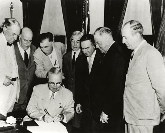 President Truman Signing Atomic Energy Act of 1946 